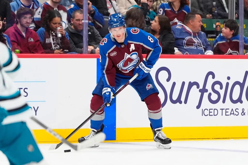 Nov 26, 2025; Denver, Colorado, USA; Colorado Avalanche defenseman Cale Makar (8) controls the puck in the second period against the San Jose Sharks at Ball Arena.