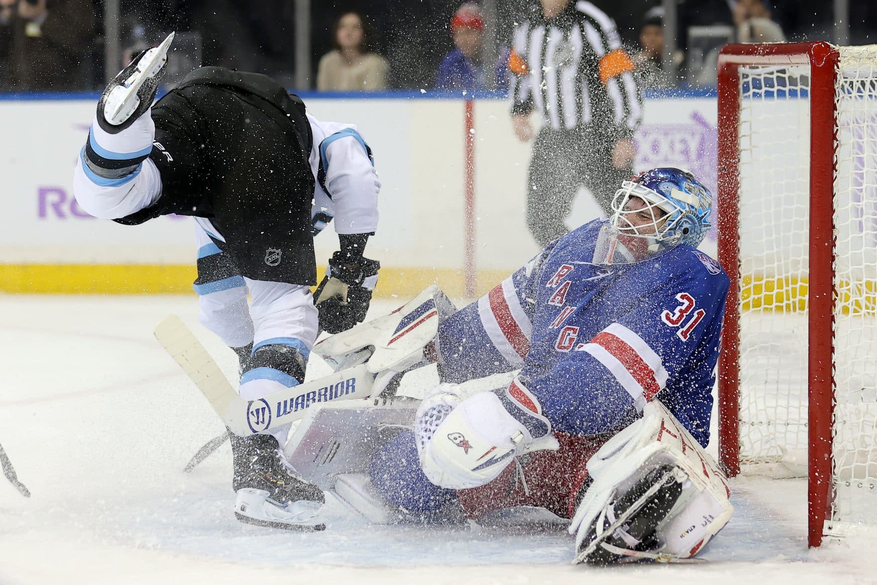 New York Rangers goaltender Igor Shesterkin (31) reacts after being skated into by Utah Mammoth right wing JJ Peterka (77) during the first period at Madison Square Garden. Shesterkin left the game with an injury after the play.