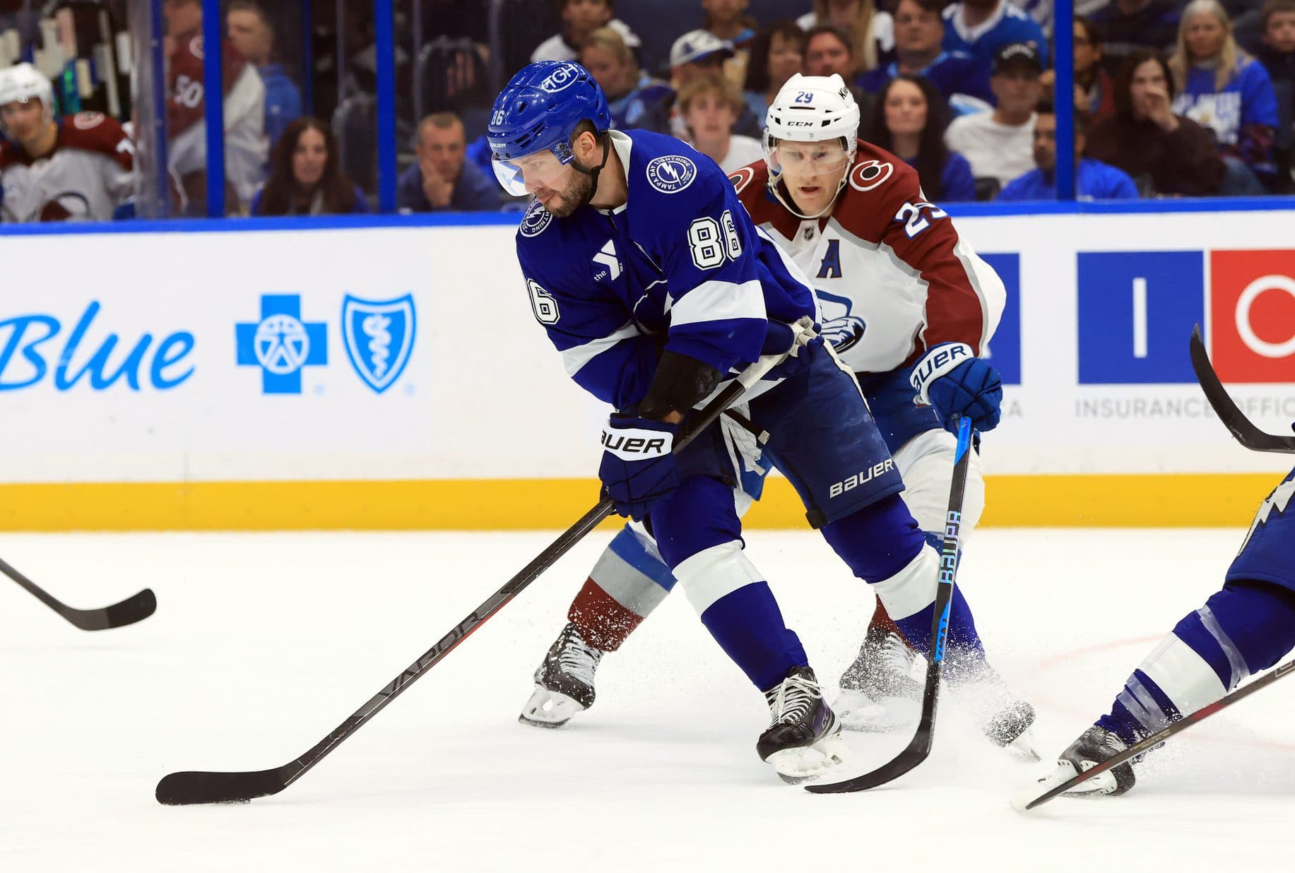 Colorado Avalanche center Nathan MacKinnon (29) defends Tampa Bay Lightning right wing Nikita Kucherov (86) during the third period at Benchmark International Arena.