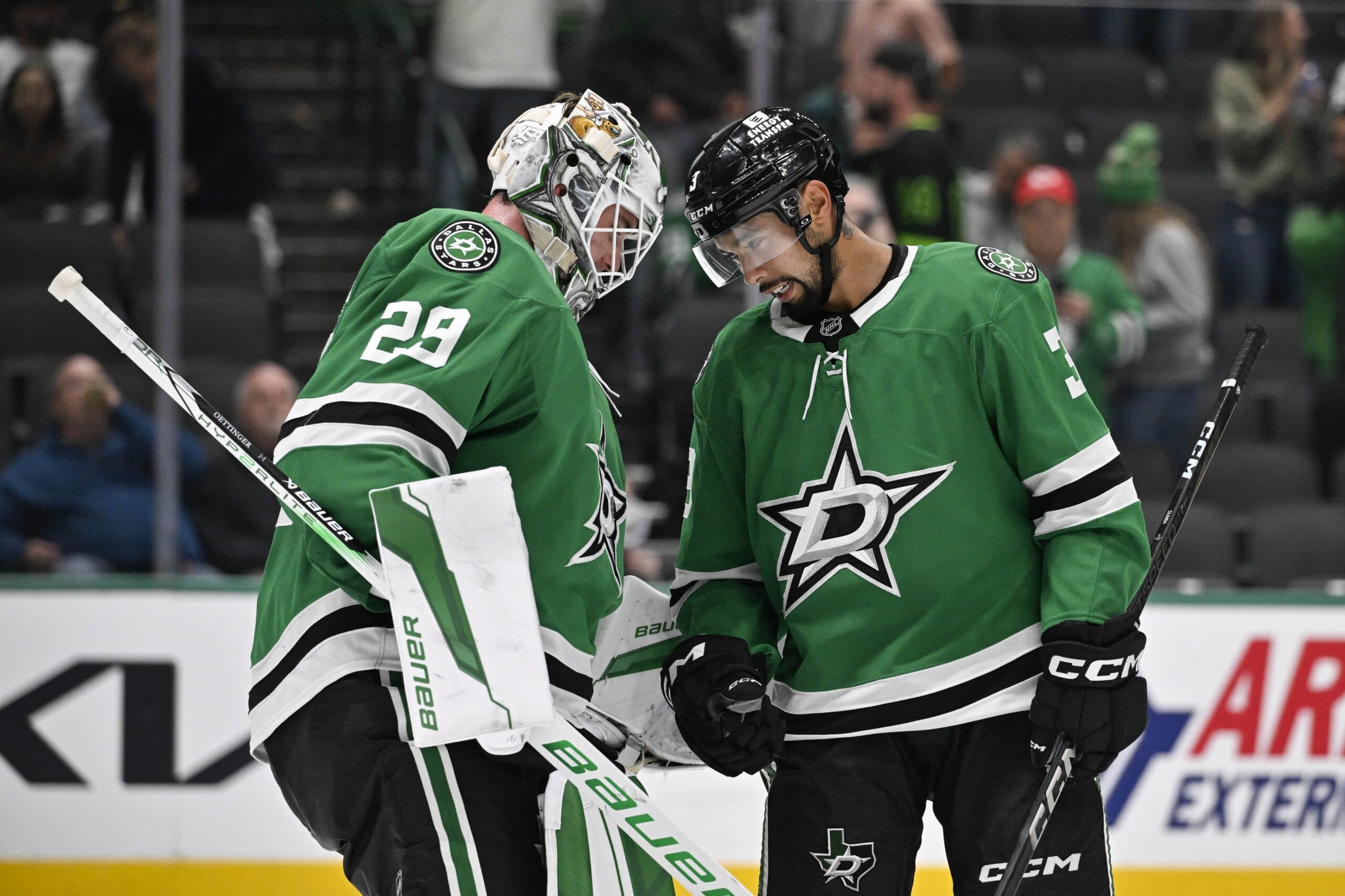 Dallas Stars goaltender Jake Oettinger (29) and defenseman Matt Dumba (3) celebrate the Stars victory of the Chicago Blackhawks at the American Airlines Center.