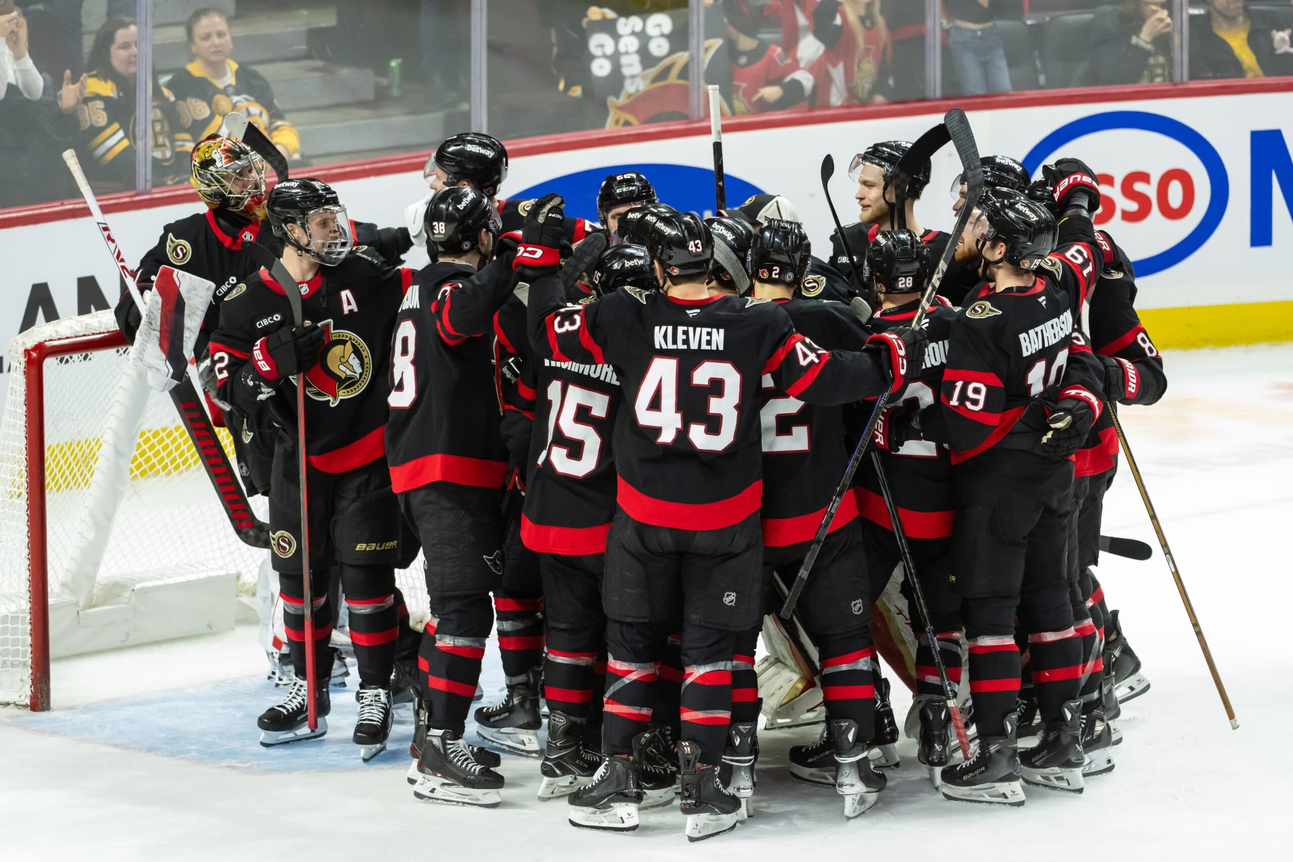 The Ottawa Senators celebrate their win against the Boston Bruins following a shootout at the Canadian Tire Centre.