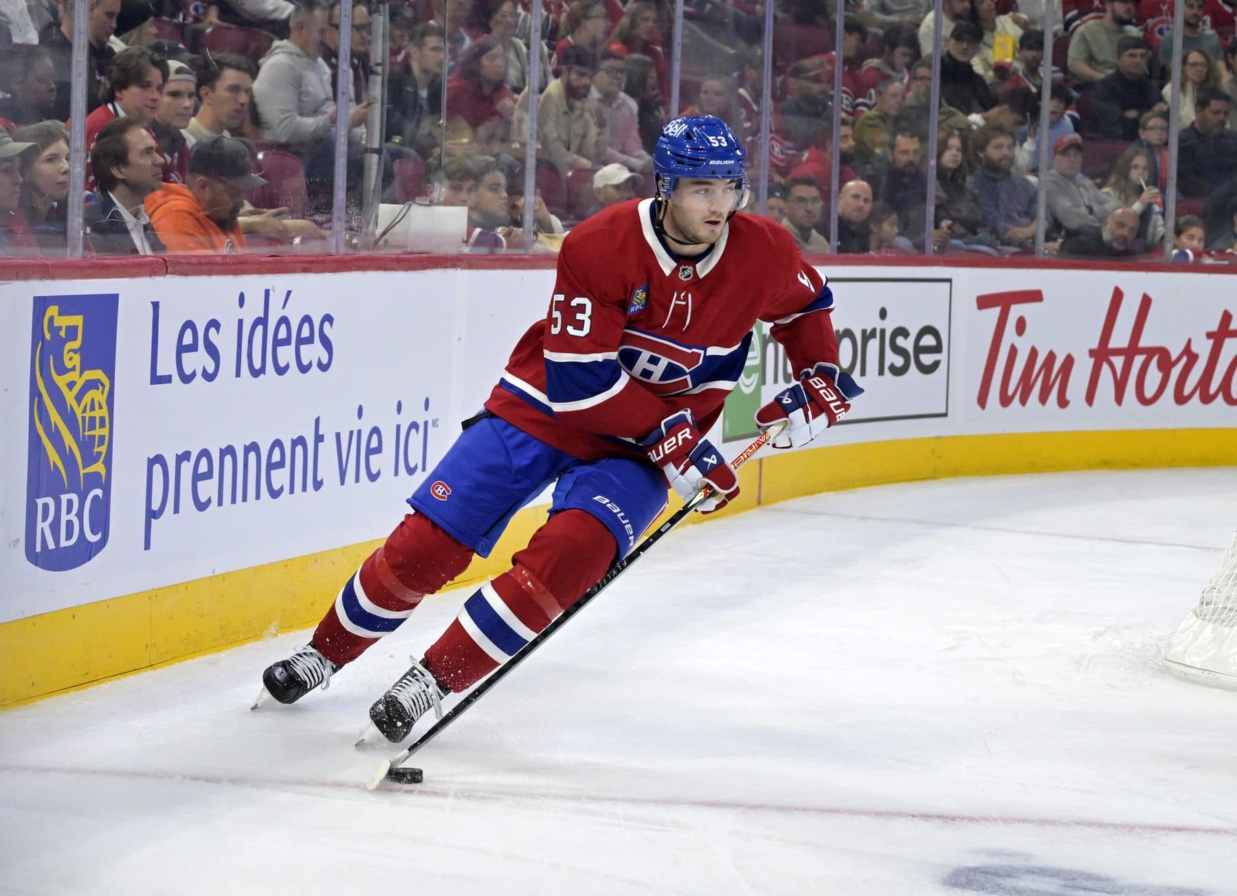 Montreal Canadiens defenseman Noah Dobson (53) plays the puck during the first period of the game against the Pittsburgh Penguins at the Bell Centre.