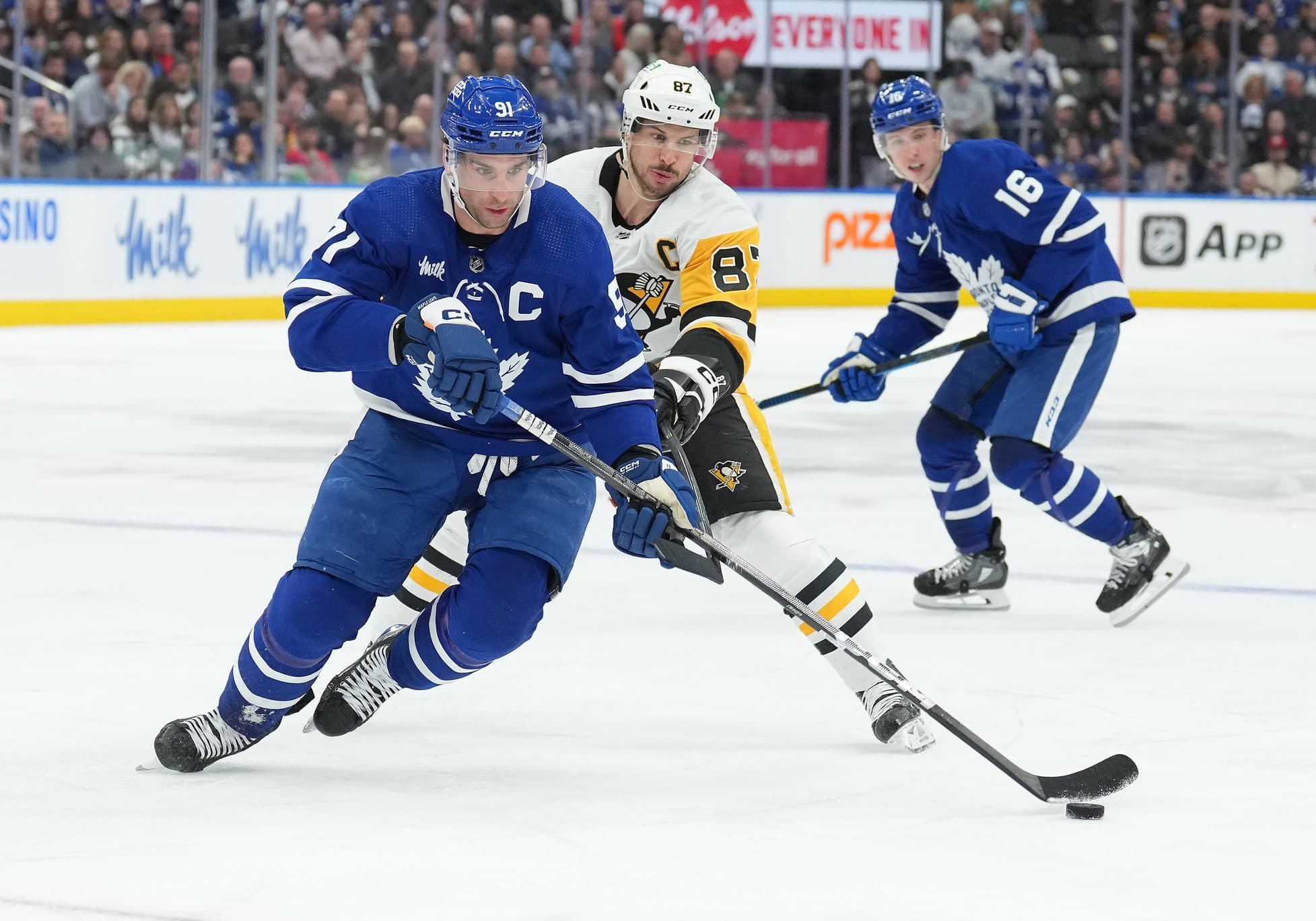 Toronto Maple Leafs center John Tavares (91) battles for the puck with Pittsburgh Penguins center Sidney Crosby (87) during the third period at Scotiabank Arena.