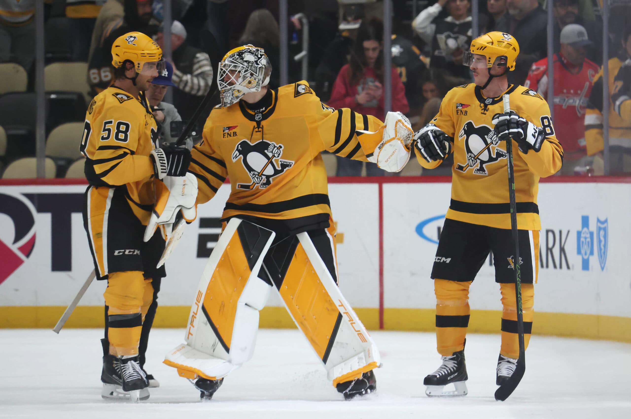 Kris Letang, Arturs Silovs and Sidney Crosby