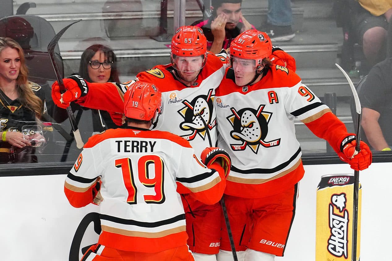 Anaheim Ducks defenseman Jacob Trouba (65) celebrates with center Leo Carlsson (91) and right wing Troy Terry (19) after scoring a goal against the Vegas Golden Knights during an overtime period to give the Ducks a 4-3 victory at T-Mobile Arena.