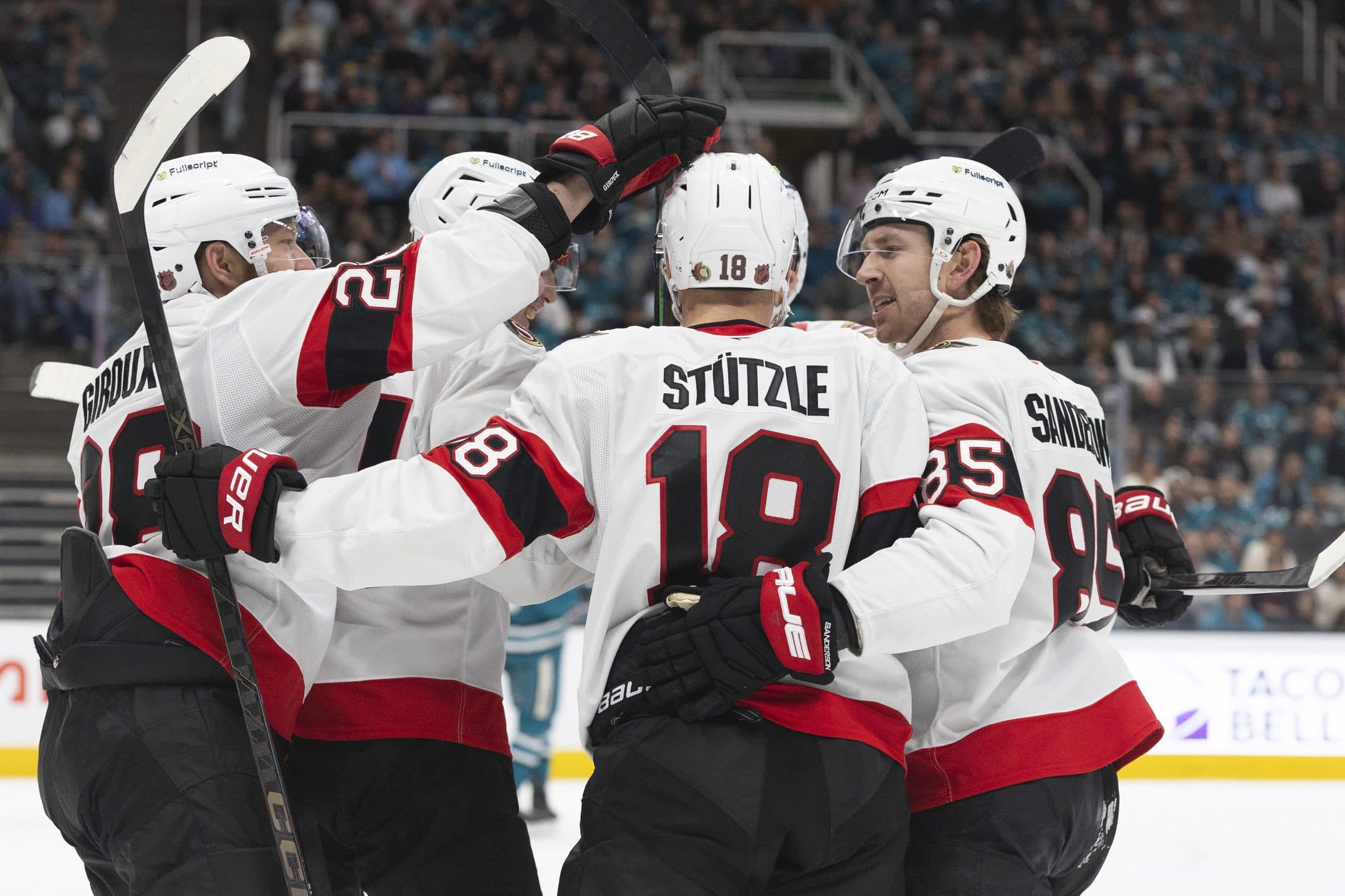 Ottawa Senators center Tim Sttzle (18) is surrounded by his teammates after assisting on a goal during the first period against the San Jose Sharks at SAP Center at San Jose.