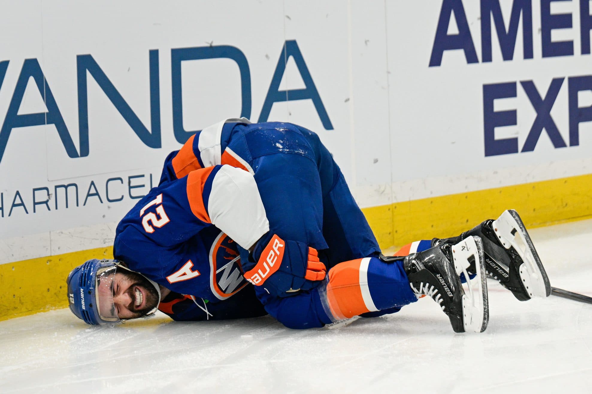 New York Islanders center Kyle Palmieri (21) falls to the ice after an injury against the Philadelphia Flyers during the second period at UBS Arena.
