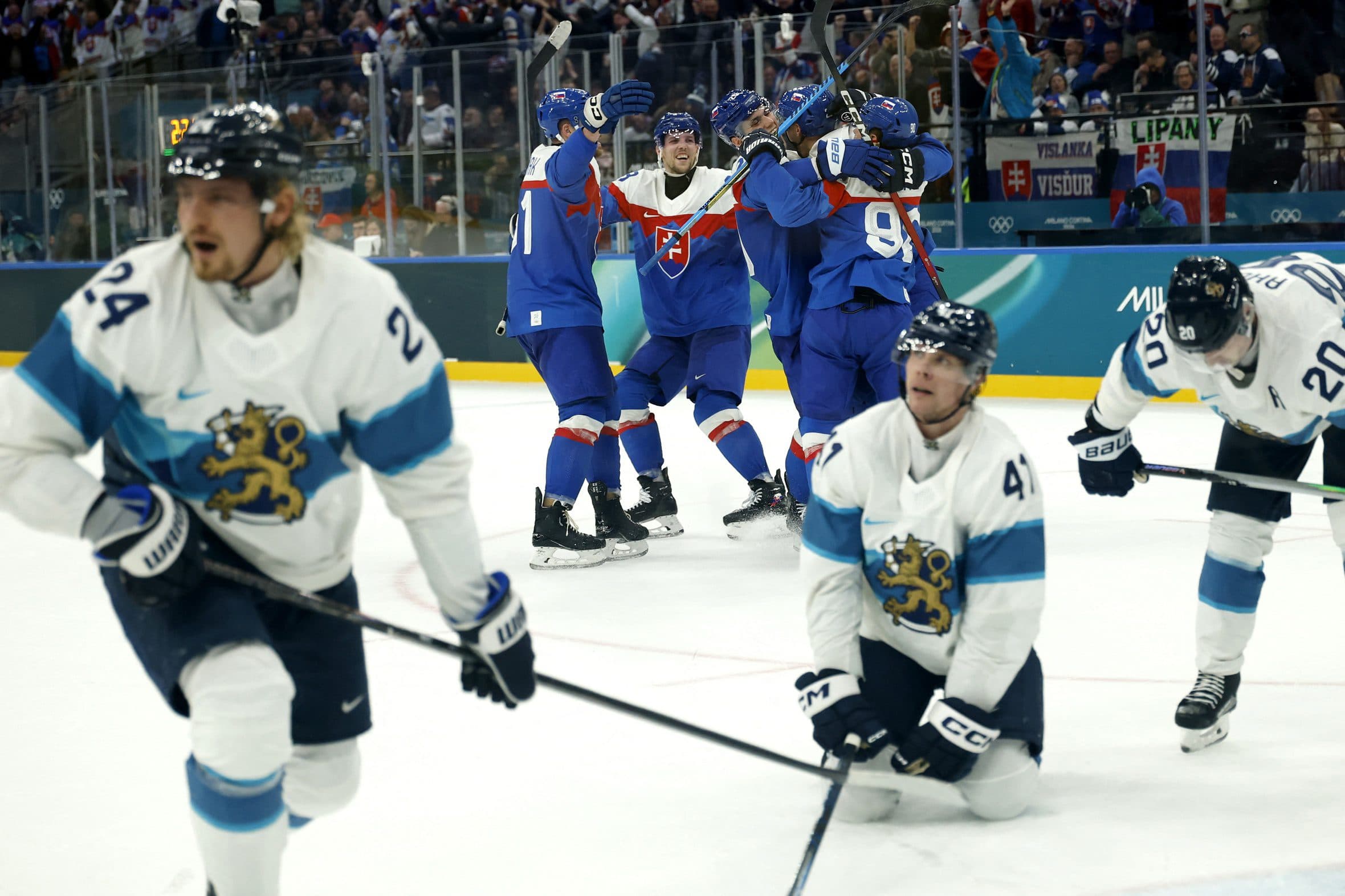 Adam Ruzicka of Slovakia celebrates scoring their fourth goal with teammates against Finland in men's ice hockey group B play during the Milano Cortina 2026 Olympic Winter Games at Milano Santagiulia Ice Hockey Arena.