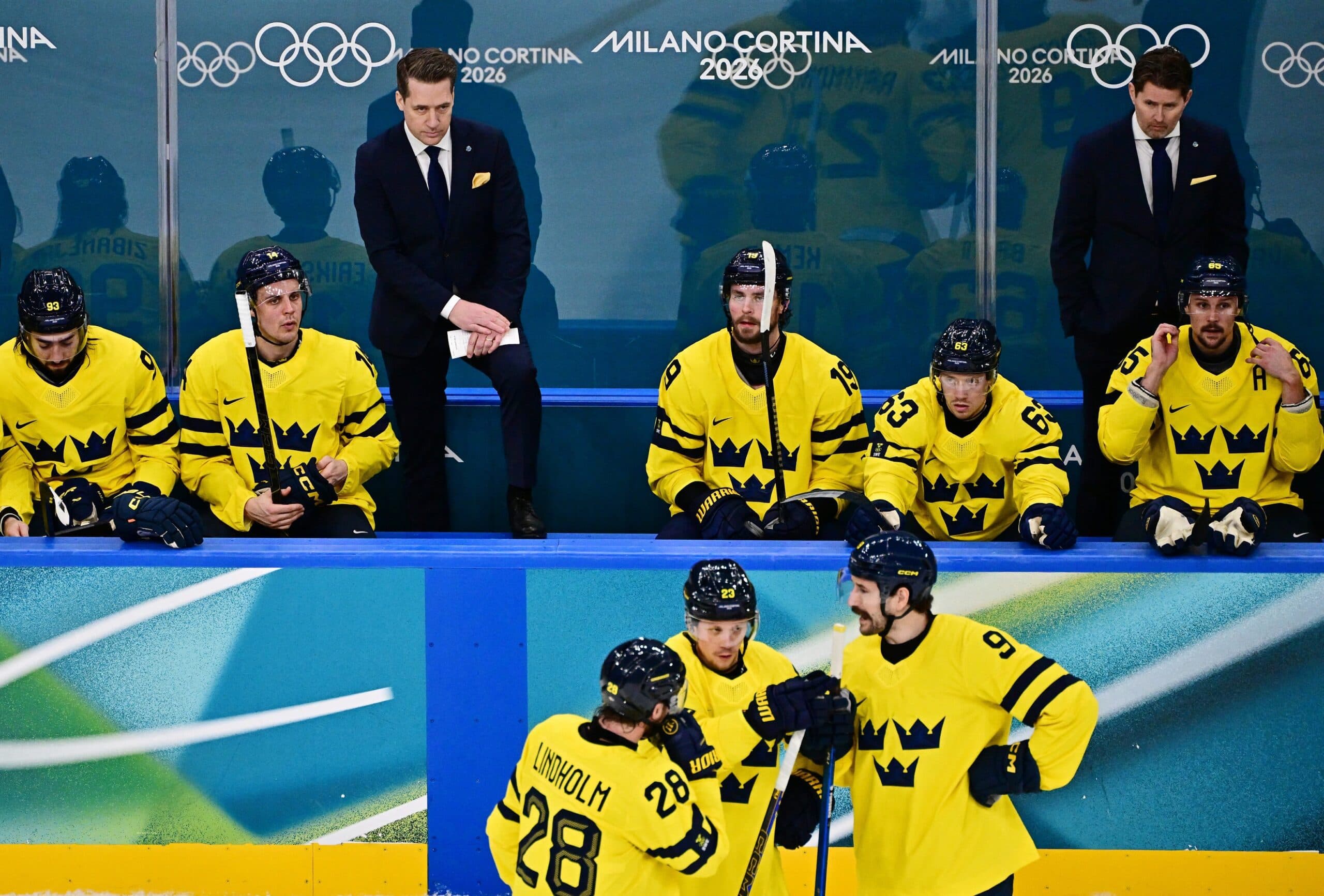 head coach Sam Hallam of Sweden in action against Finland in men's ice hockey Group B play during the Milano Cortina 2026 Olympic Winter Games at Milano Santagiulia Ice Hockey Arena.