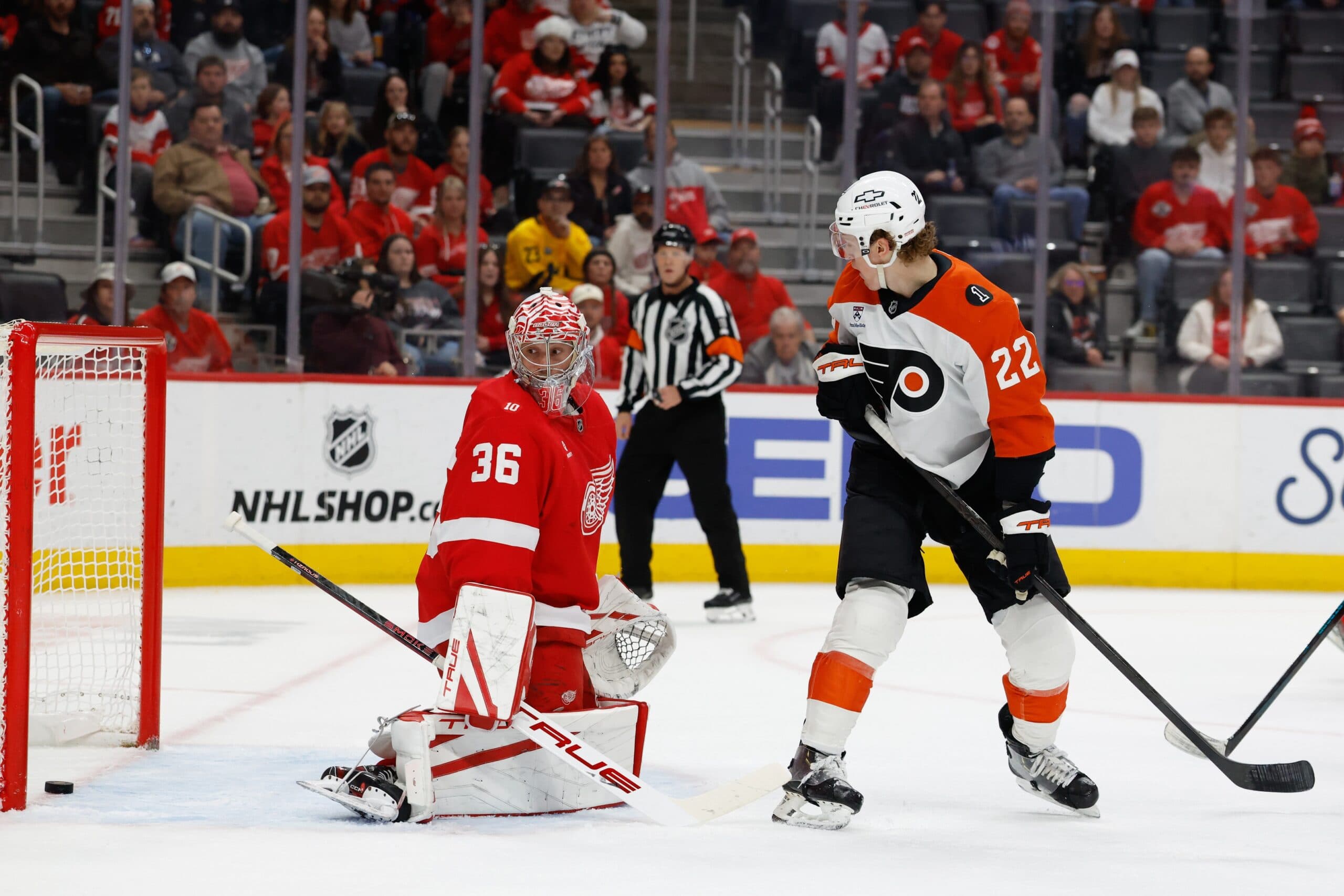 Philadelphia Flyers center Christian Dvorak (22) deflects the puck passed Detroit Red Wings goaltender John Gibson (36) to score in the first period at Little Caesars Arena.