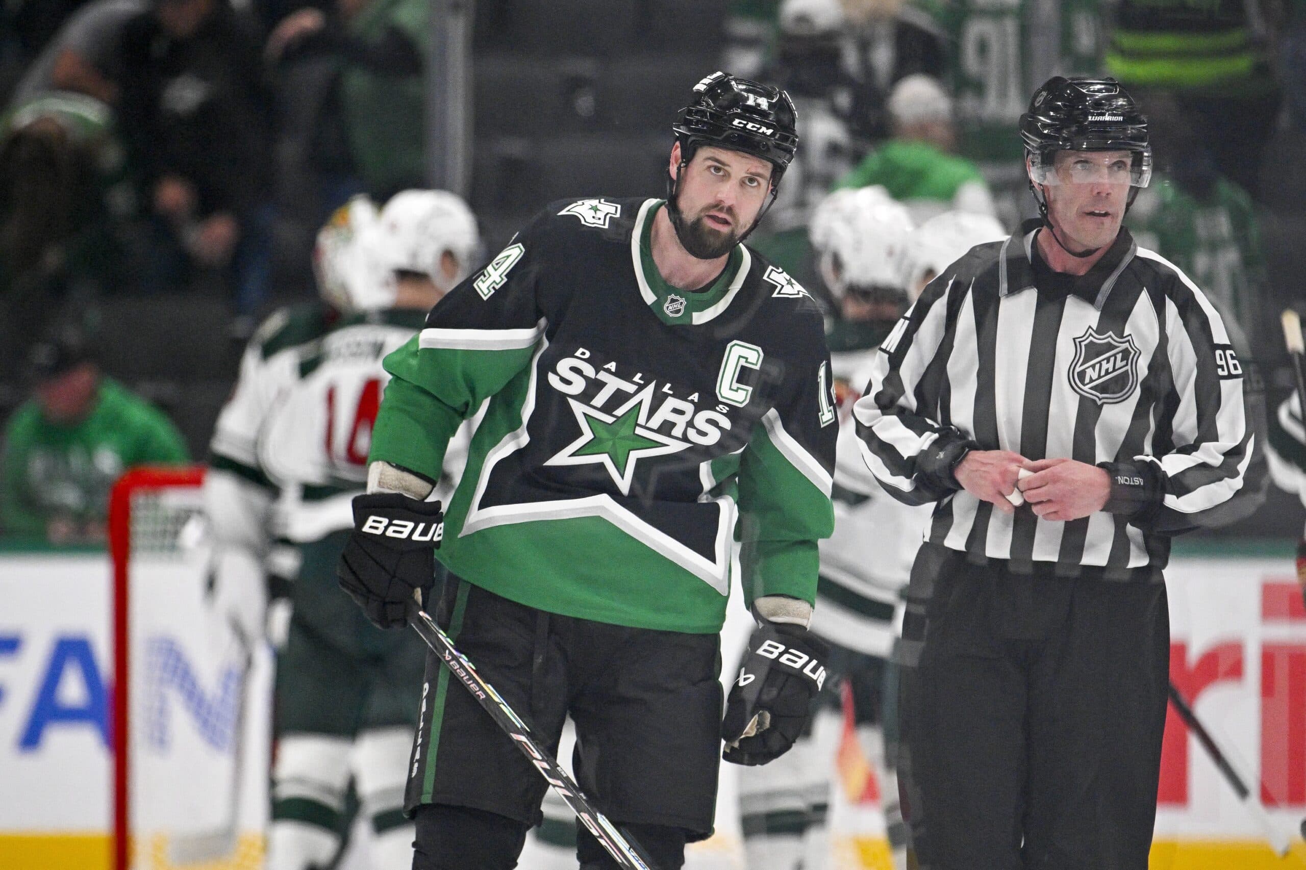 Dallas Stars left wing Jamie Benn (14) skates off the ice as the Minnesota Wild celebrate their win over the Stars in game five of the first round of the 2026 Stanley Cup Playoffs at American Airlines Center.